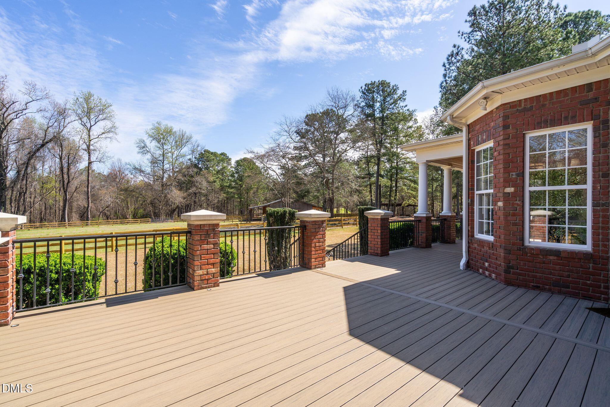 1609 Holland Road Fuquay-Varina, NC 27526 - Photo 57 of 79 a view of a house with wooden deck