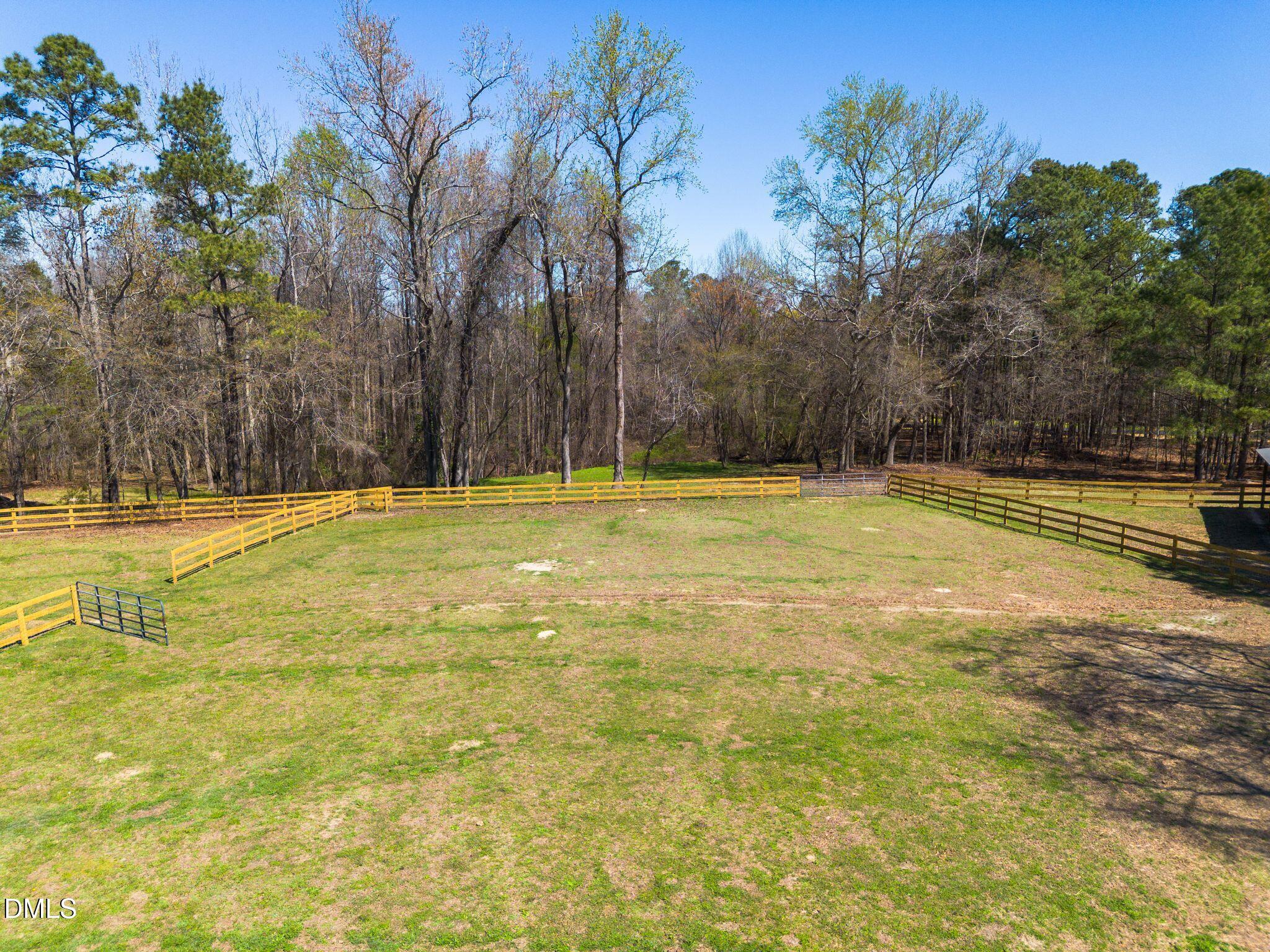 1609 Holland Road Fuquay-Varina, NC 27526 - Photo 71 of 79 a view of a swimming pool with an outdoor space and seating area