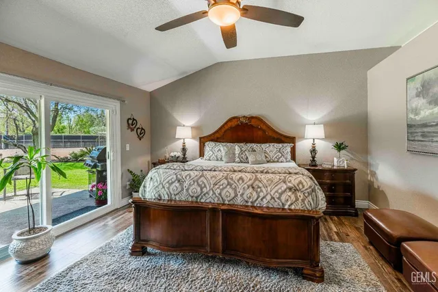 a bedroom with a bed lamp and window
