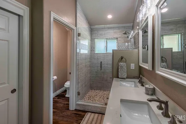 a bathroom with a shower and a sink