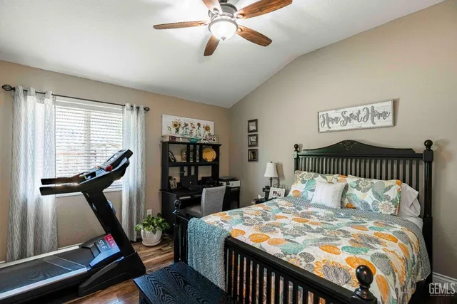a bedroom with a bed and a book shelf