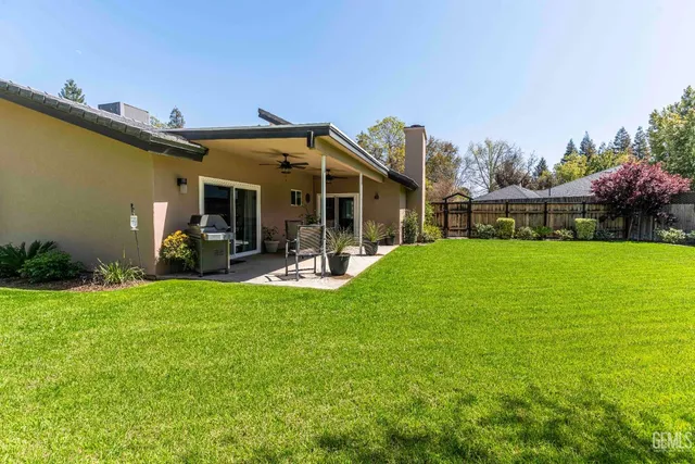 a view of a chair and tables in the garden