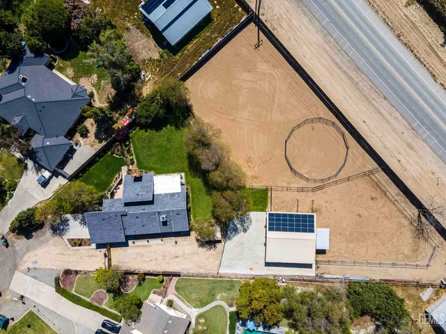 an aerial view of a house with swimming pool