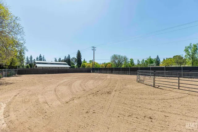 a view of a backyard with sitting area