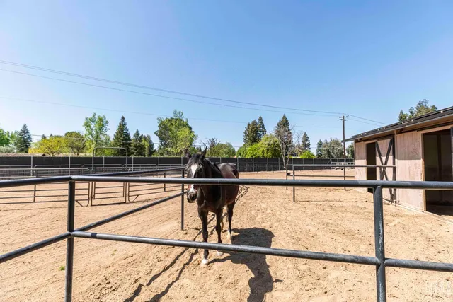 a view of a backyard with sitting area