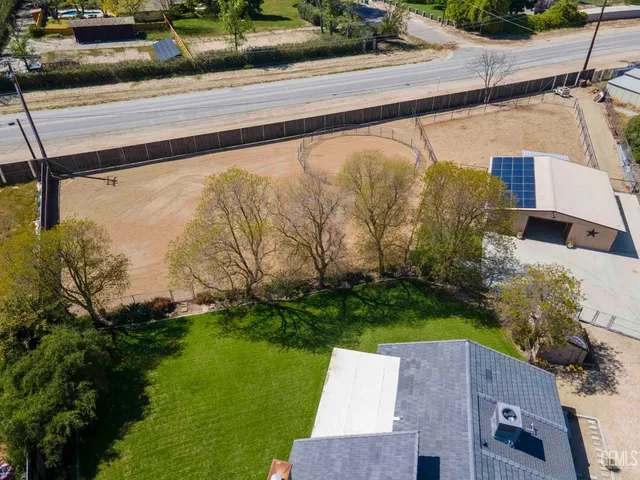 a view of road with large trees