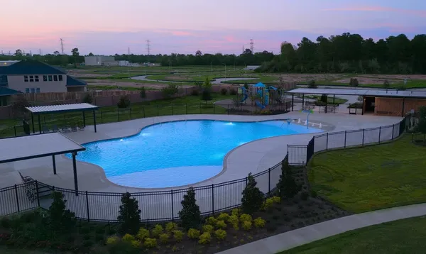 a view of a swimming pool with a table and chairs