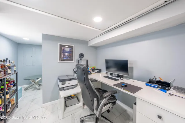 a view of a workspace with furniture