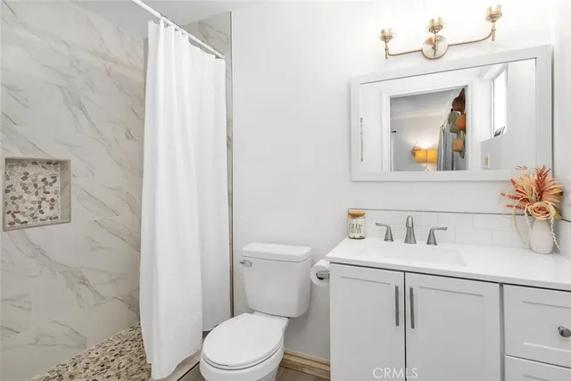 a bedroom with bed and a window