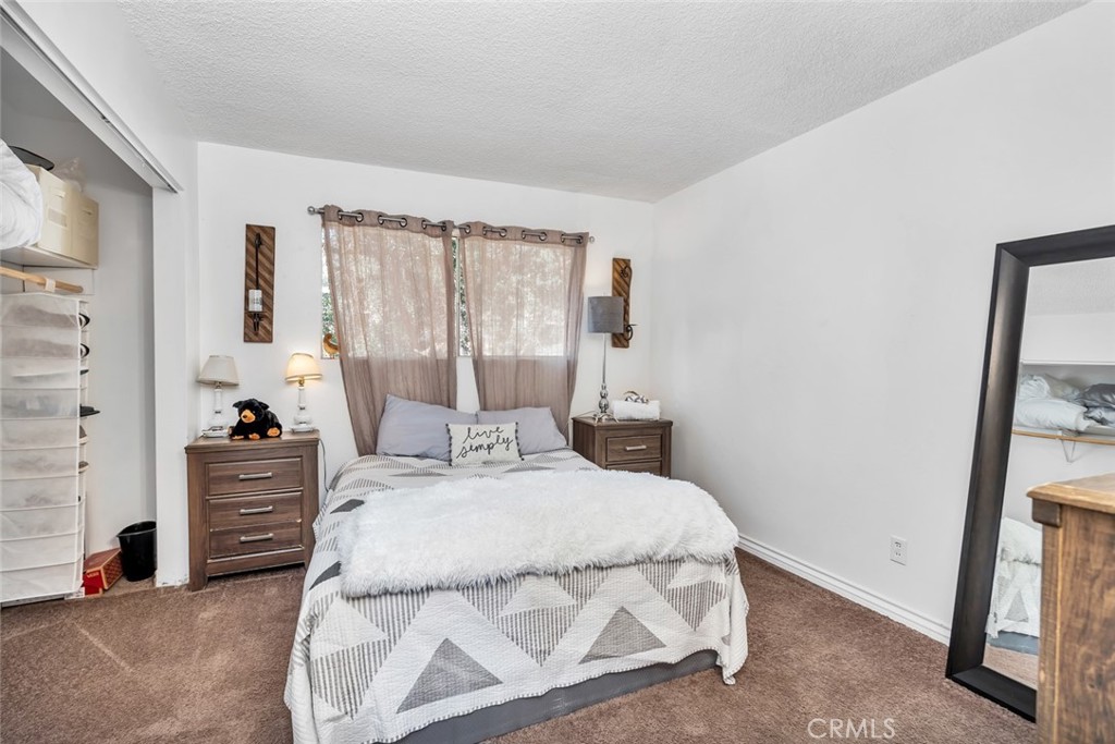245 Mountain Shadow Road Wofford Heights, CA 93285 - Photo 15 of 72 a bedroom with a bed and a mirror