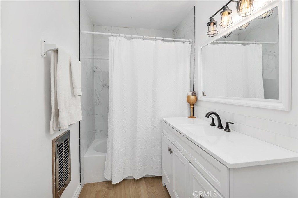 245 Mountain Shadow Road Wofford Heights, CA 93285 - Photo 16 of 72 a bathroom with a sink a mirror and a shower