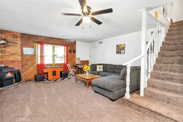 a view of a house with backyard sitting area and garden