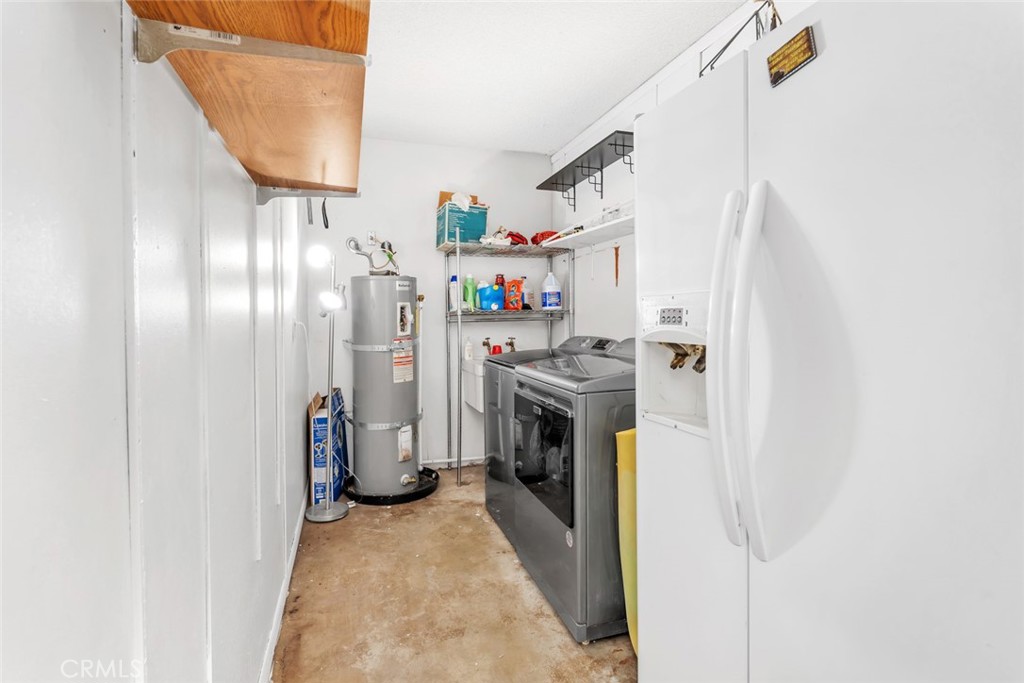245 Mountain Shadow Road Wofford Heights, CA 93285 - Photo 19 of 72 a storage room with water heater and racks