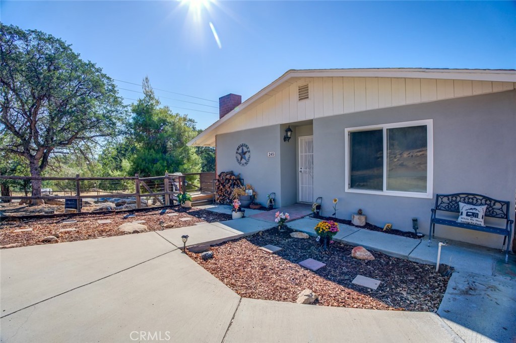 245 Mountain Shadow Road Wofford Heights, CA 93285 - Photo 2 of 72 a backyard of a house with seating space