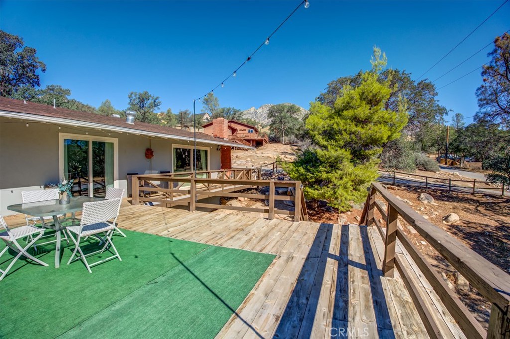 245 Mountain Shadow Road Wofford Heights, CA 93285 - Photo 22 of 72 a view of a house with backyard porch and sitting area