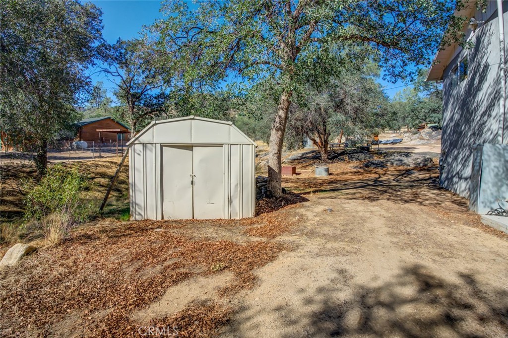 245 Mountain Shadow Road Wofford Heights, CA 93285 - Photo 27 of 72 a view of a yard with large trees