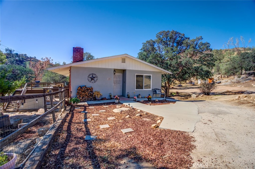 245 Mountain Shadow Road Wofford Heights, CA 93285 - Photo 28 of 72 a view of a house with backyard and sitting area