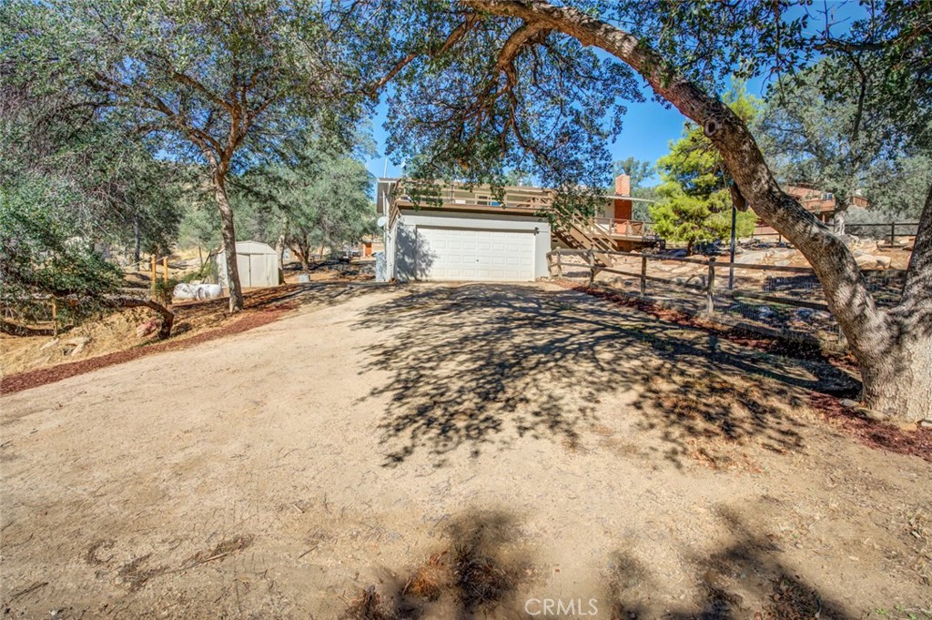 245 Mountain Shadow Road Wofford Heights, CA 93285 - Photo 31 of 72 a view of a house with a yard and garage