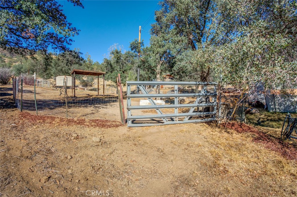 245 Mountain Shadow Road Wofford Heights, CA 93285 - Photo 39 of 72 a view of a yard with wooden fence