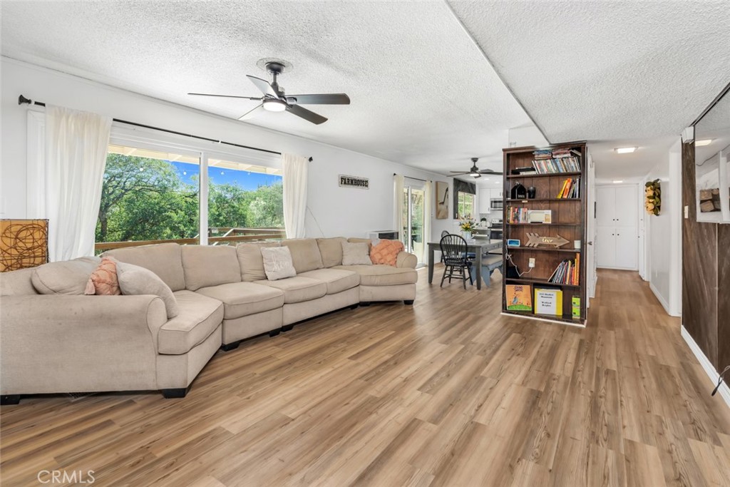 245 Mountain Shadow Road Wofford Heights, CA 93285 - Photo 4 of 72 a living room with furniture and a wooden floor