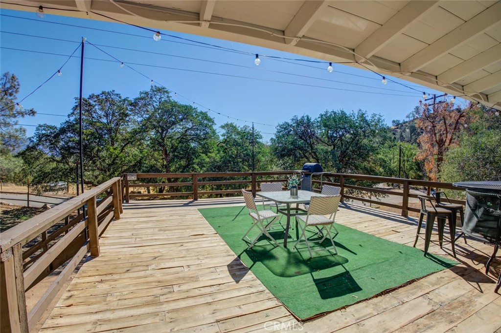 245 Mountain Shadow Road Wofford Heights, CA 93285 - Photo 46 of 72 a view of a chairs and table on the terrace