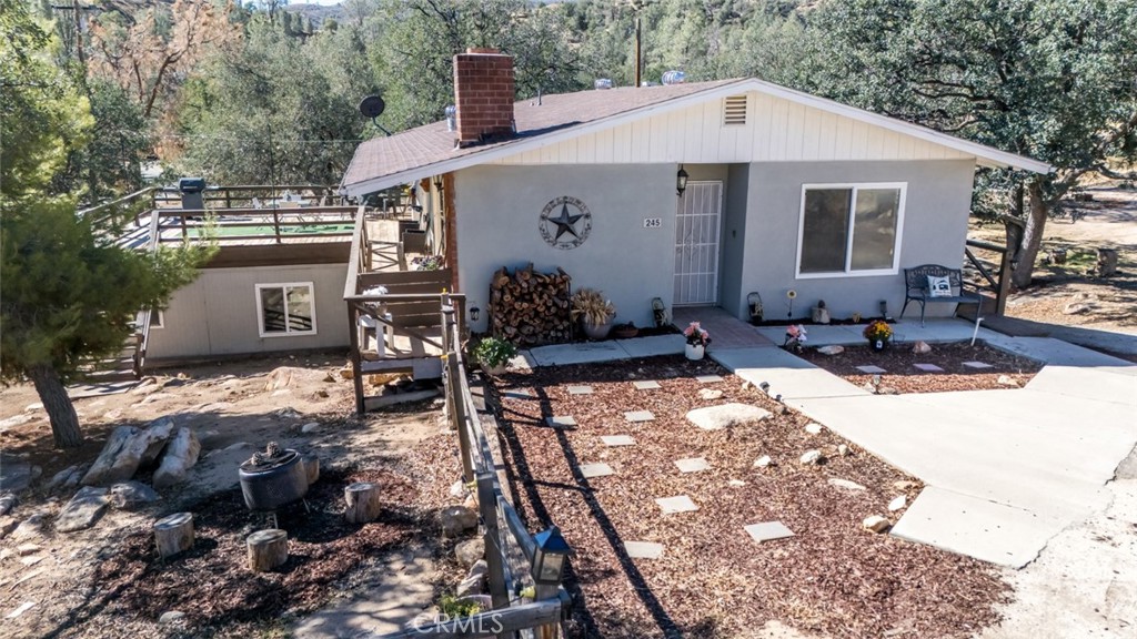 245 Mountain Shadow Road Wofford Heights, CA 93285 - Photo 59 of 72 a front view of a house with a yard