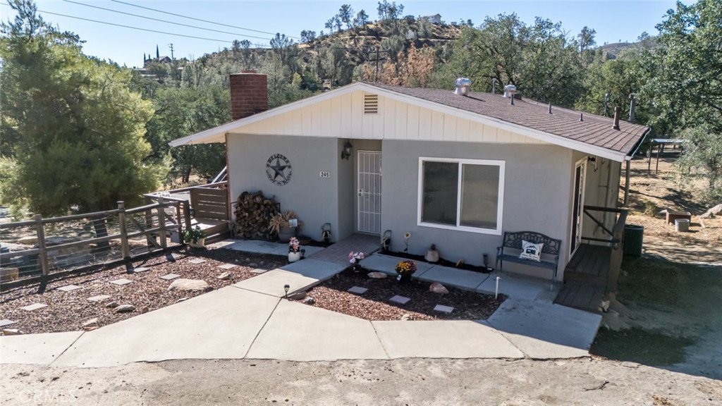 245 Mountain Shadow Road Wofford Heights, CA 93285 - Photo 61 of 72 a front view of a house with garden