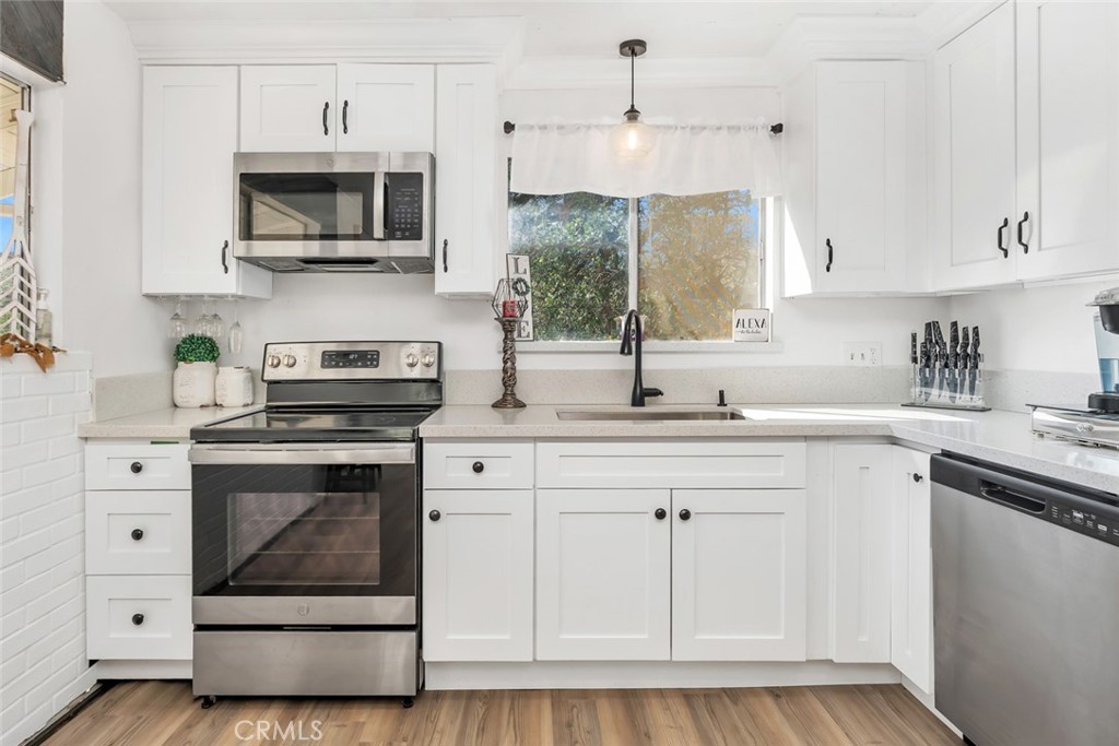 245 Mountain Shadow Road Wofford Heights, CA 93285 - Photo 9 of 72 a kitchen with stainless steel appliances a stove sink and microwave