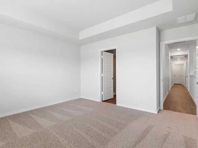 a view of an empty room and closet