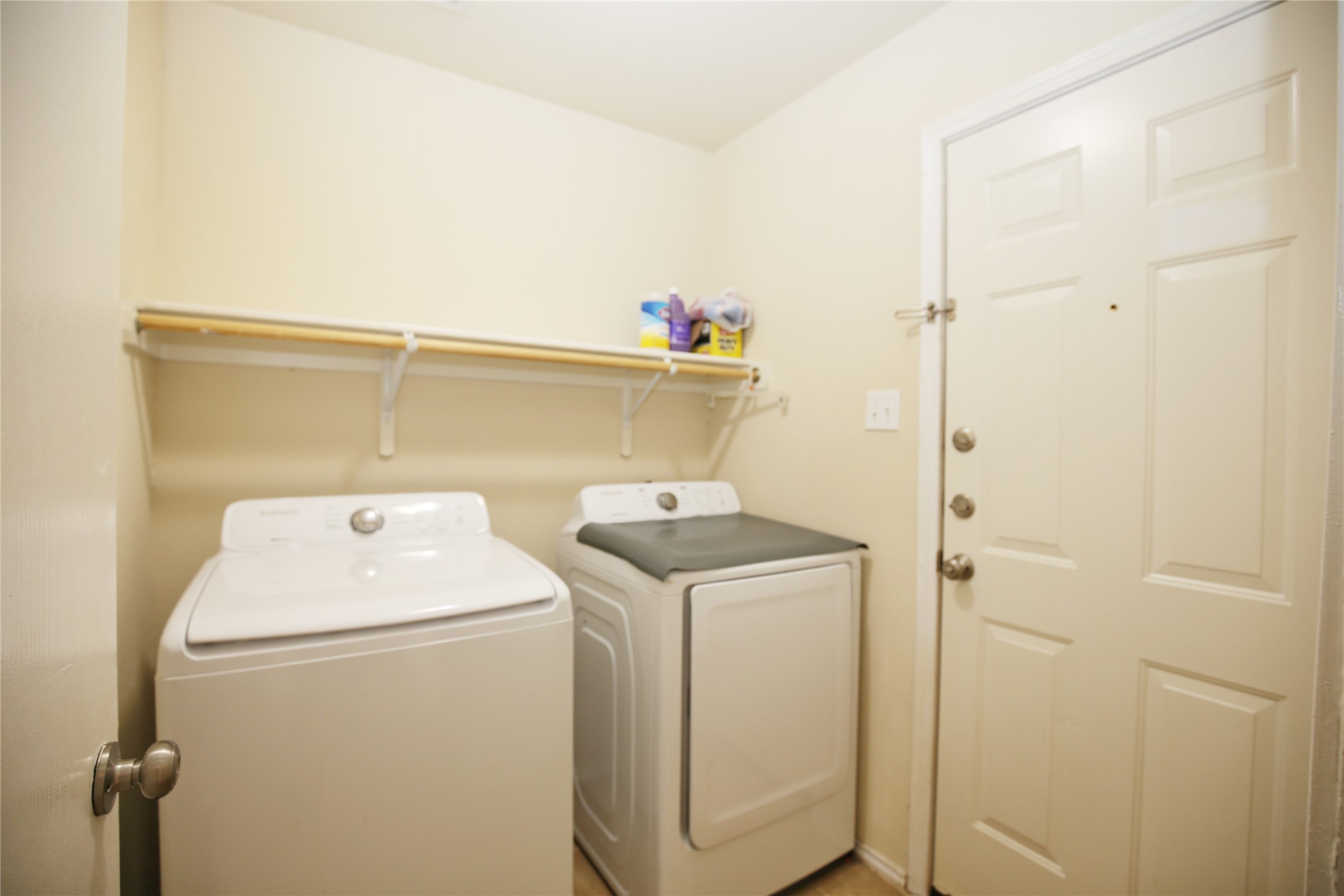 213 Rim Rock Drive Leander, TX 78641 - Photo 12 of 21 a utility room with dryer and washer