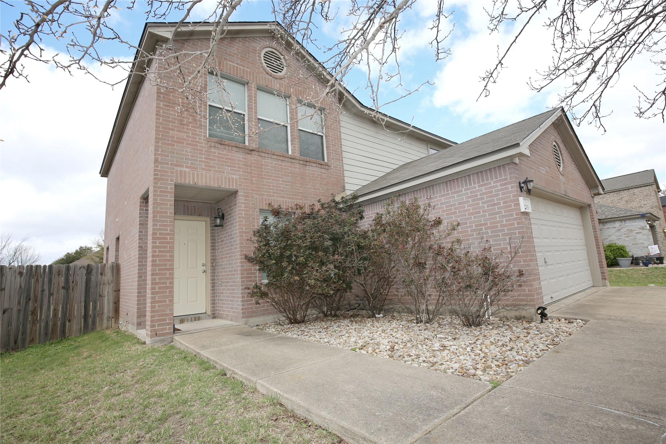 213 Rim Rock Drive Leander, TX 78641 - Photo 2 of 21 a front view of a house with a yard