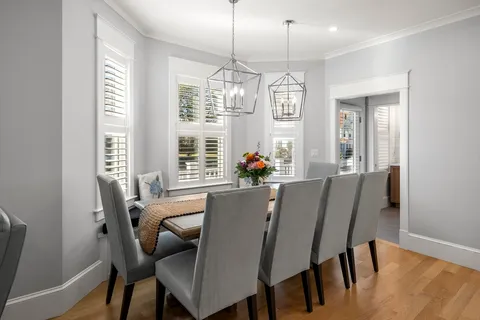 a view of a dining room with furniture window and outside view
