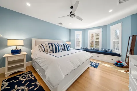 a bedroom with a bed and a couch