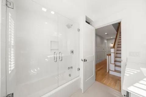 a bathroom with a bathtub and a shower