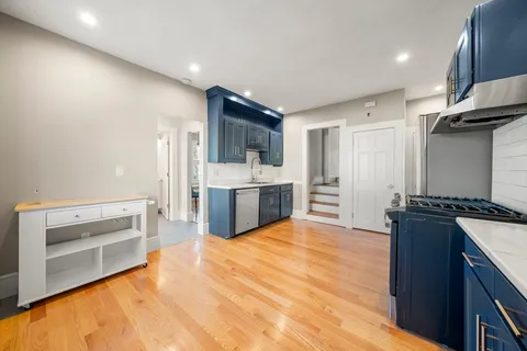 a kitchen with stainless steel appliances a stove and a refrigerator