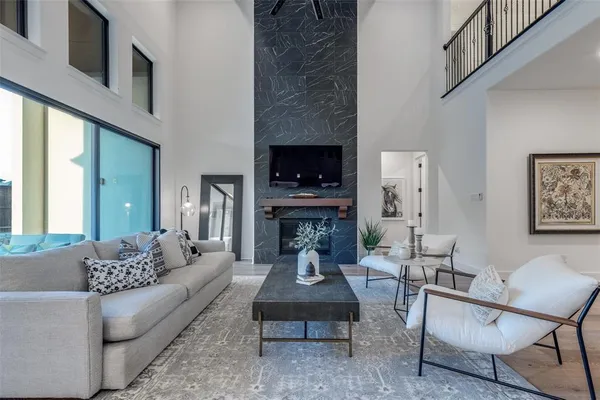 a living room with furniture and a fireplace