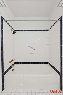 a bathroom with a shower and a bathtub