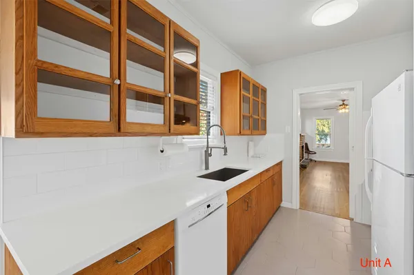 a kitchen with a sink and a refrigerator