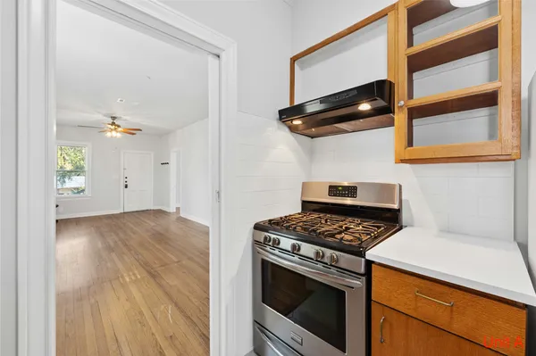 a kitchen that has a stove and a microwave