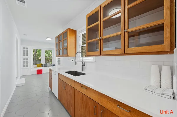 a kitchen with a sink and a window