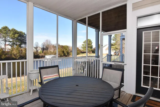 a view of a chair and table in the balcony