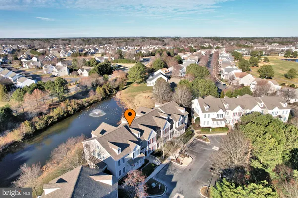 an aerial view of a city and lake view