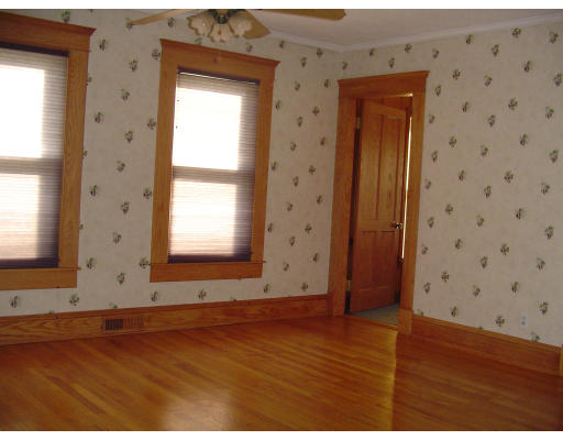 119 Farnsworth Street Springfield, MA 01107 - Photo 23 of 23 an empty room with wooden floor and windows