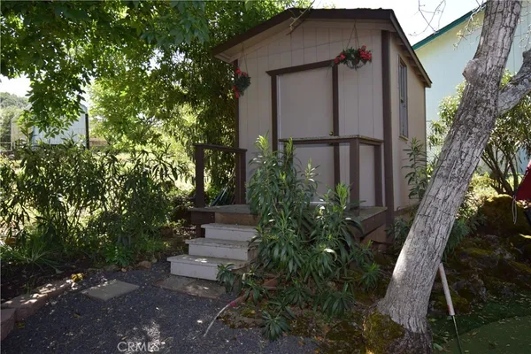 a kitchen with stainless steel appliances granite countertop a refrigerator a stove a sink and dishwasher