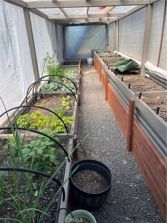 a kitchen with stainless steel appliances kitchen island granite countertop a refrigerator and a stove top oven