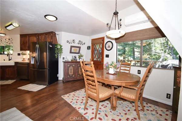 a kitchen with a sink a stove and a microwave