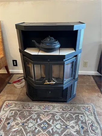 a living room with furniture a flat screen tv and a large window
