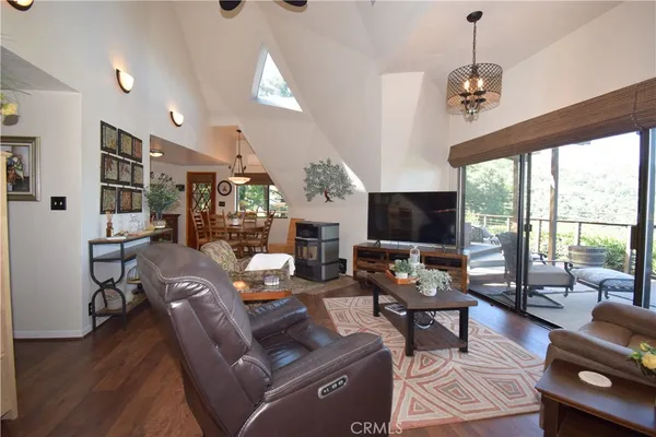 a bedroom with a bed and a lamp on dresser