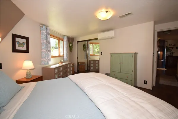 a bathroom with a sink and mirror with window