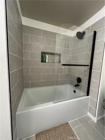 a backyard of a house with a yard and outdoor seating